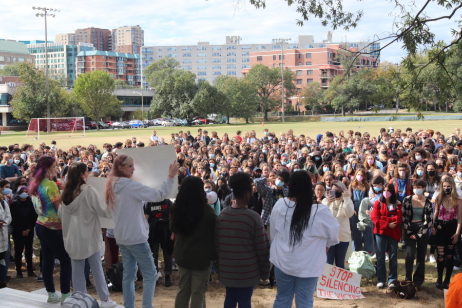 Walkout+leaders+stand+in+front+of+a+crowd+in+protest+of+sexual+assault+in+Arlington+Public+Schools.+The+walkout+took+place+on+October+22+this+school+year.+%0A