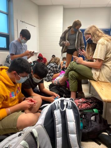 Students hide in the locker room during the October 6 lockdown. They were later released by ACPD.