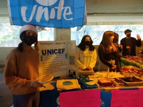 Becerra alongside the UNICEF club at last year’s holiday bazaar. 
