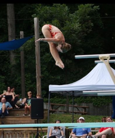 Joyce completes a dive in front of a panel of judges. In December, Joyce competed in the Junior World Championships.