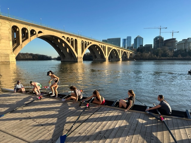 Members of the crew team exit the boat during a practice. On the water practices only occur during the spring season. 