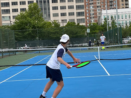 Varsity tennis captain Quinn Breed playing a tennis match in 2023 for the school. Photo courtesy of Quinn Breed. 
