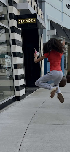 Tween girl jumping out of excitement for Sephora

