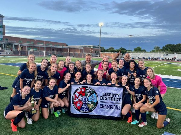 The girls varsity soccer team poses after winning the district championship game against Yorktown last year. 


