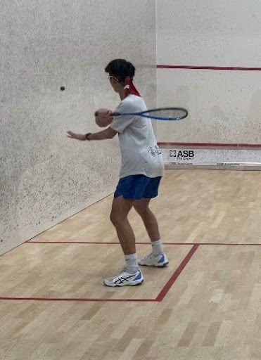 Christian Keng is playing Squash at a local gym. He was training for his Division One career for the University of Virginia squash team.