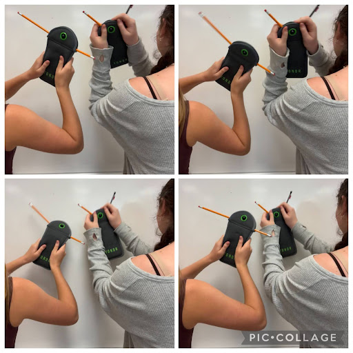  Students attempt to get their pouches open during school. Desperation for their phones took a hold of them. 